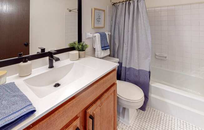 Bathroom with large vanity at Hillsborough Apartments.