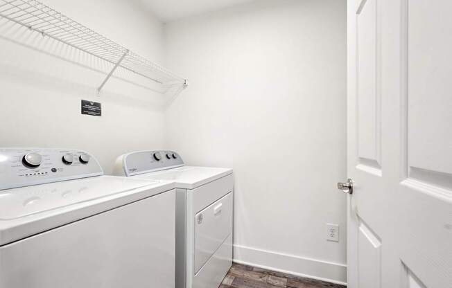 A laundry room with a washer and dryer.