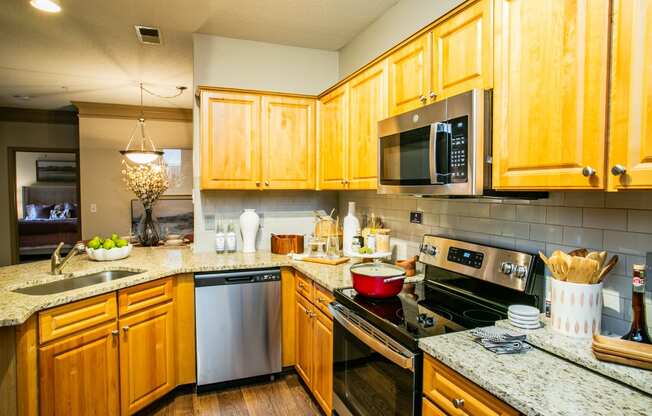 Full Kitchen with Granite Countertops at Spacious Apartments Near North Druid Hills, GA