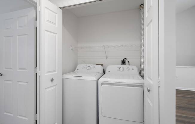 a washer and dryer in the laundry room of a house