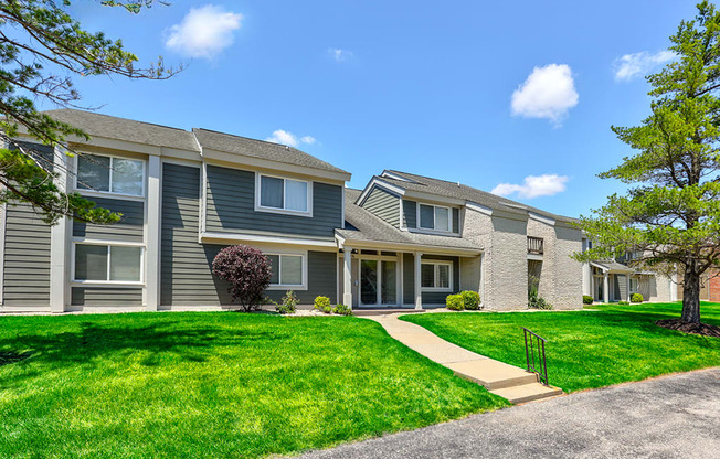 Exterior of a building at Somerset Lakes Apartments, showcasing a well-maintained facade and surrounding landscaping.