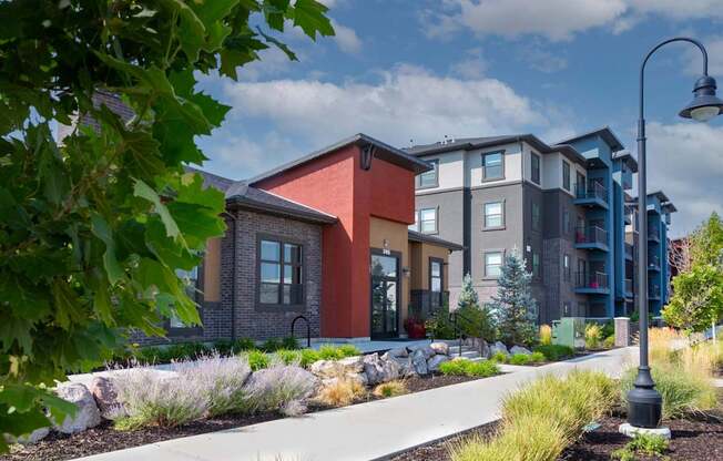 A modern apartment complex with a variety of colors on the buildings.