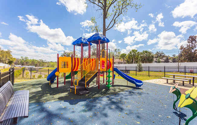 a playground at the enclave at woodbridge apartments in sugar land, tx