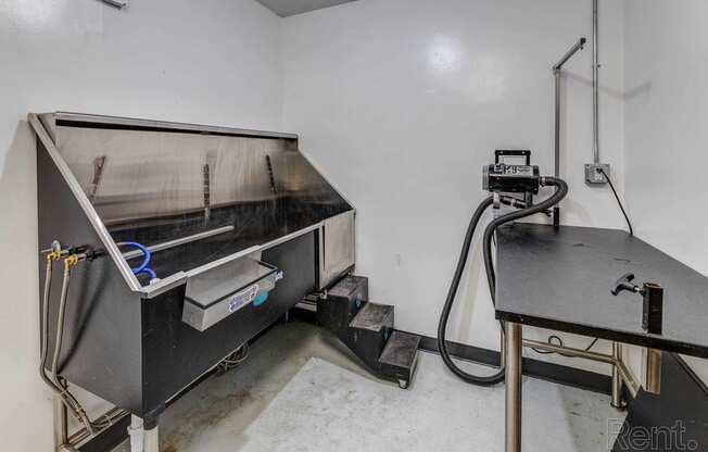 the inside of a room with a stove and a table