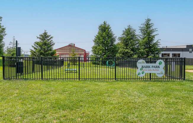 a park with a fence and a sign that reads park park  at Timber Glen Apartments, Batavia, Ohio