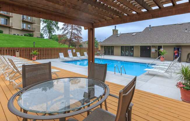 Swimming Pool side seating area at Cloverset Valley Apartments, Kansas City, 64114