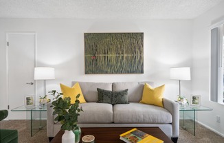 a living room with a couch and a table