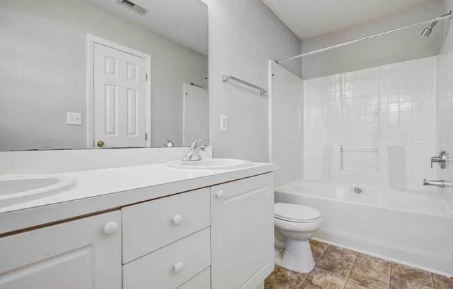 a bathroom with a sink toilet and a tub