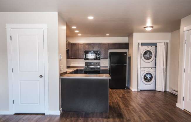 a kitchen with a washer and a dryer in it at Madison Park, Montana, 59718