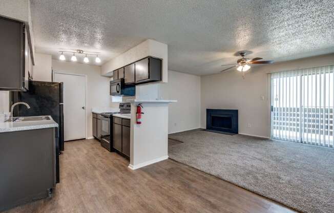 Cobble Hill Apartments in Fort Worth, Texas Kitchen and Living Room with Fireplace