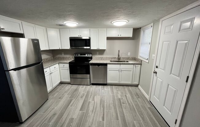 Renovated 3/1 w/carport and detached garage