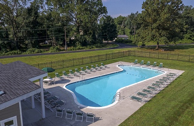 Closer aerial view of apartment swimming pool and lounging chairs in Hatboro, PA rental homes