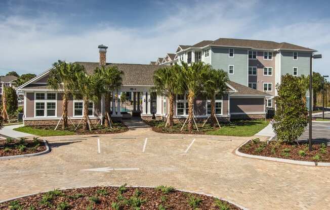 a large house with palm trees in front of it