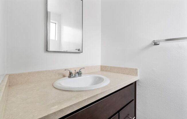 a bathroom with a sink and a mirror