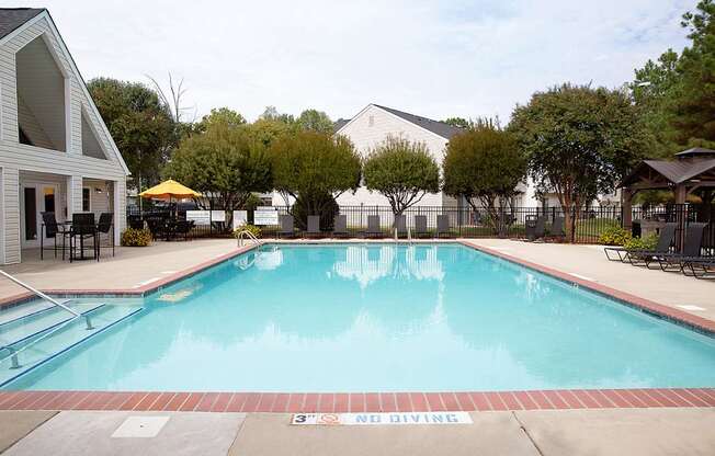 A pool with a diving sign on the side.