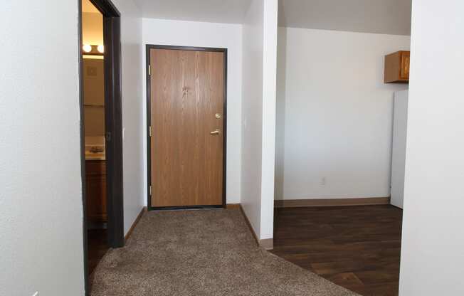 a view of a door from the living room into the kitchen