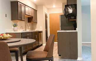 Kitchen and dining at Summerhill Estates Apartments in Lansing, MI