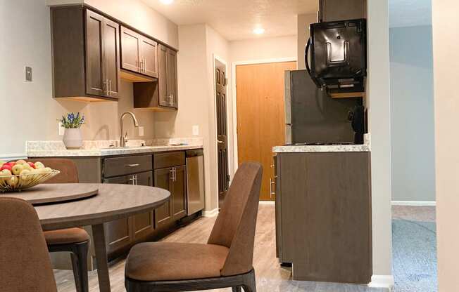 Kitchen and dining at Summerhill Estates Apartments in Lansing, MI
