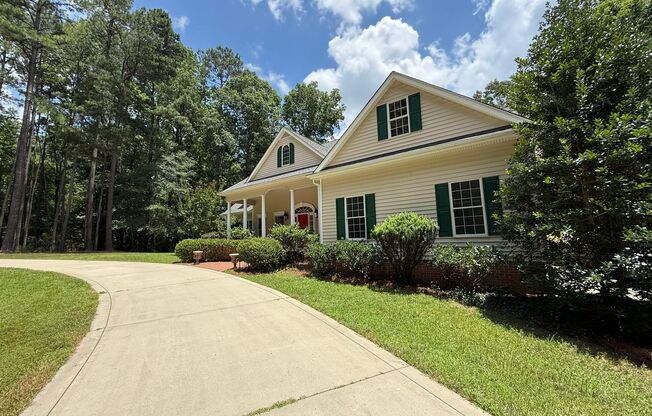 Tranquil and Secluded Raleigh Home with Unique Bonus Features Located on a 7+ Acre Lot on a Private Street with Plenty of Privacy and Outdoor Space