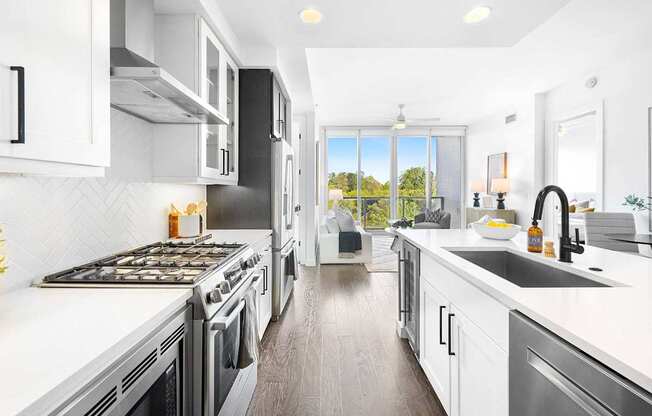 A modern kitchen with a stove top oven and a dishwasher.