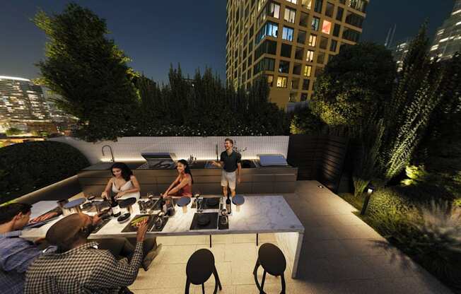 a group of people sitting around a table on a rooftop terrace at night