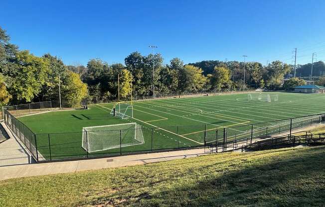 A soccer field with a goal post on the left side.