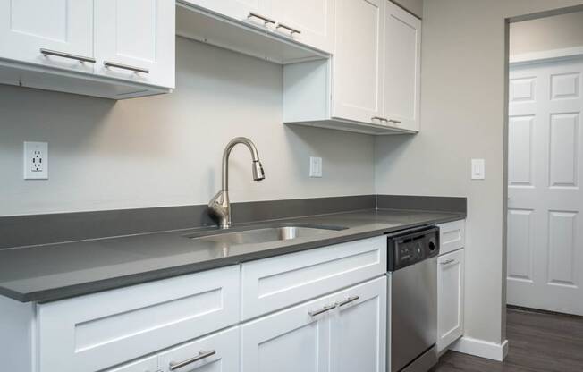Vantage at Hillsdale | #36 Kitchen with White Cabinetry and Black & Stainless Steel Appliances