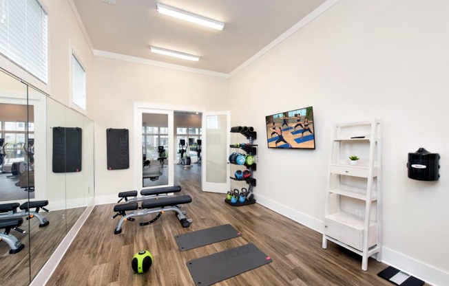 this is a photo of the fitness room in the 690 square foot 1 bedroom apartment at