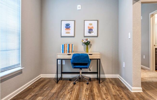 A chair and desk in a room at the Flats at Sundown in North Port, Florida