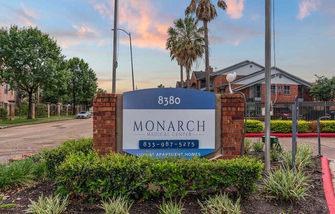 A sign for Monarch Medical Center is displayed in front of a building.
