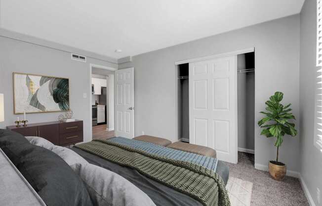 a bedroom with a bed and a closet at Station JTown, Louisville, KY, 40299