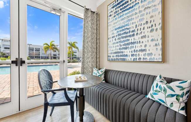 communal living room with a couch and a table and a pool