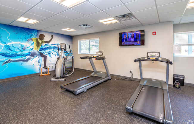 state of the art fitness center with exercise equipment apartments