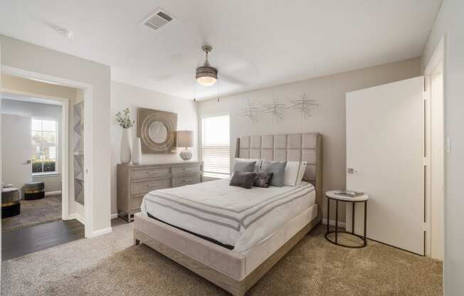 Bedroom area with bed and window at The Luxe of Southaven, Southaven, Mississippi