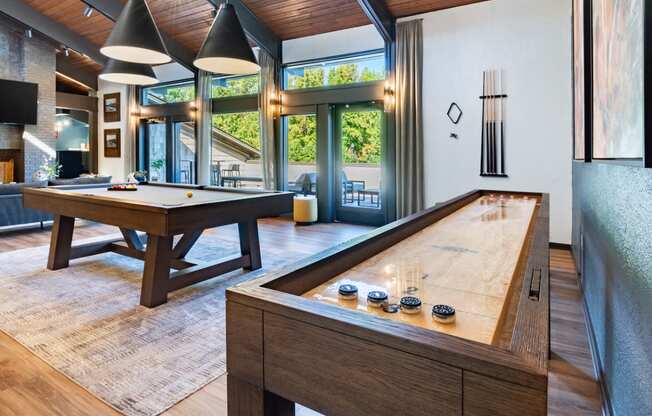 a pool table in the living room of a home with a billiards room