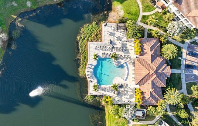 arial view of a pool and a body of water