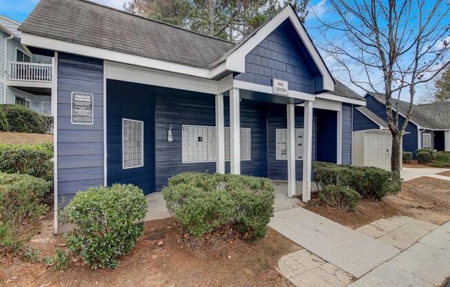 a blue and white house with a sidewalk in front of it at The Sapphire, Decatur, 30035