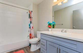 a kitchen with a sink and a mirror