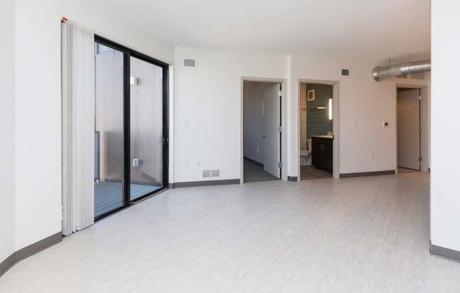 Spacious living room with neutral walls and ample natural light.