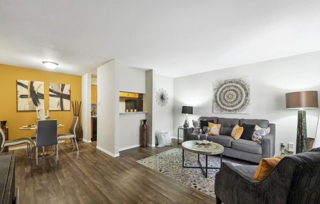 a living room with a yellow accent wall