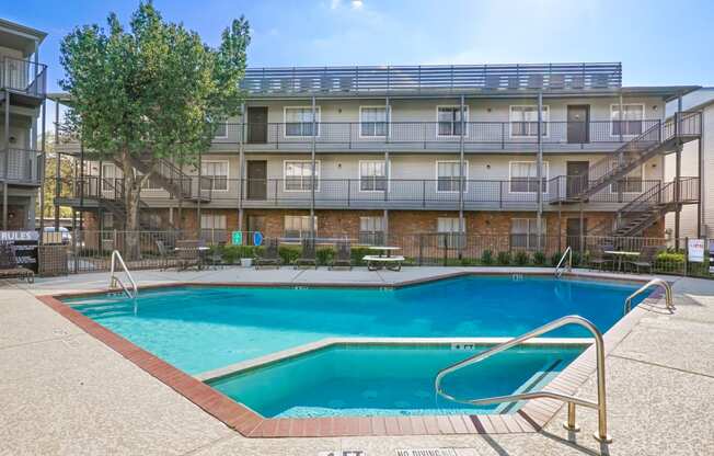 this is a photo of the pool area at harvard square apartments in dallas, tx