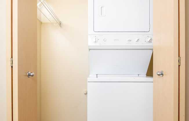 a small laundry room with a washer and dryer in a closet