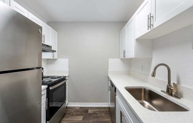 Model kitchen with appliances at Oasis at Bayside in Largo, FL.