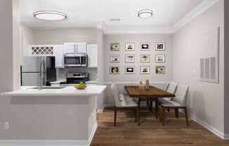 A kitchen with a dining table and chairs.