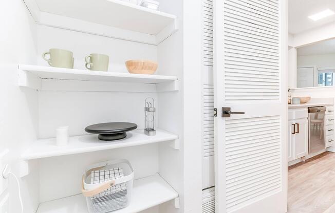 Staged shelves inside walk-in pantry at Rainbow Ridge Apartments in Kansas City, Kansas