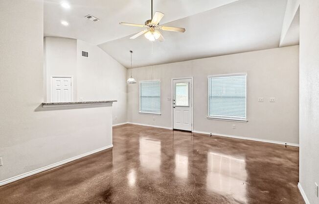 Stained Concrete Flooring - No Carpet! Fridge Included / Fenced in Backyard / Ceiling Fans /Front & Back Yard Mow & Trim Included! / CISD