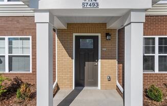 Individual portico entrances at Muskego School Apartments for seniors in Muskego, WI