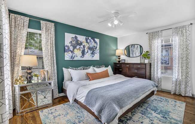 a bedroom with green walls and a white bed at Sunset Ridge, Texas, 78209