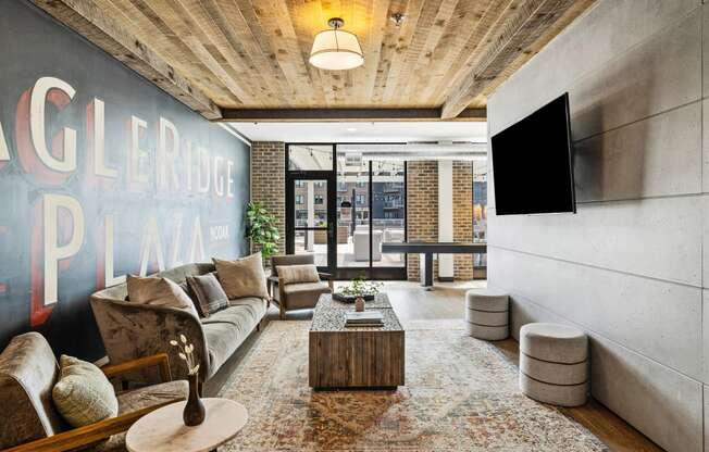 a living room with a couch and a coffee table and a tv at EagleRidge Plaza Residences, Fargo, ND