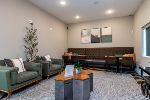 a living room with couches and chairs and a coffee table